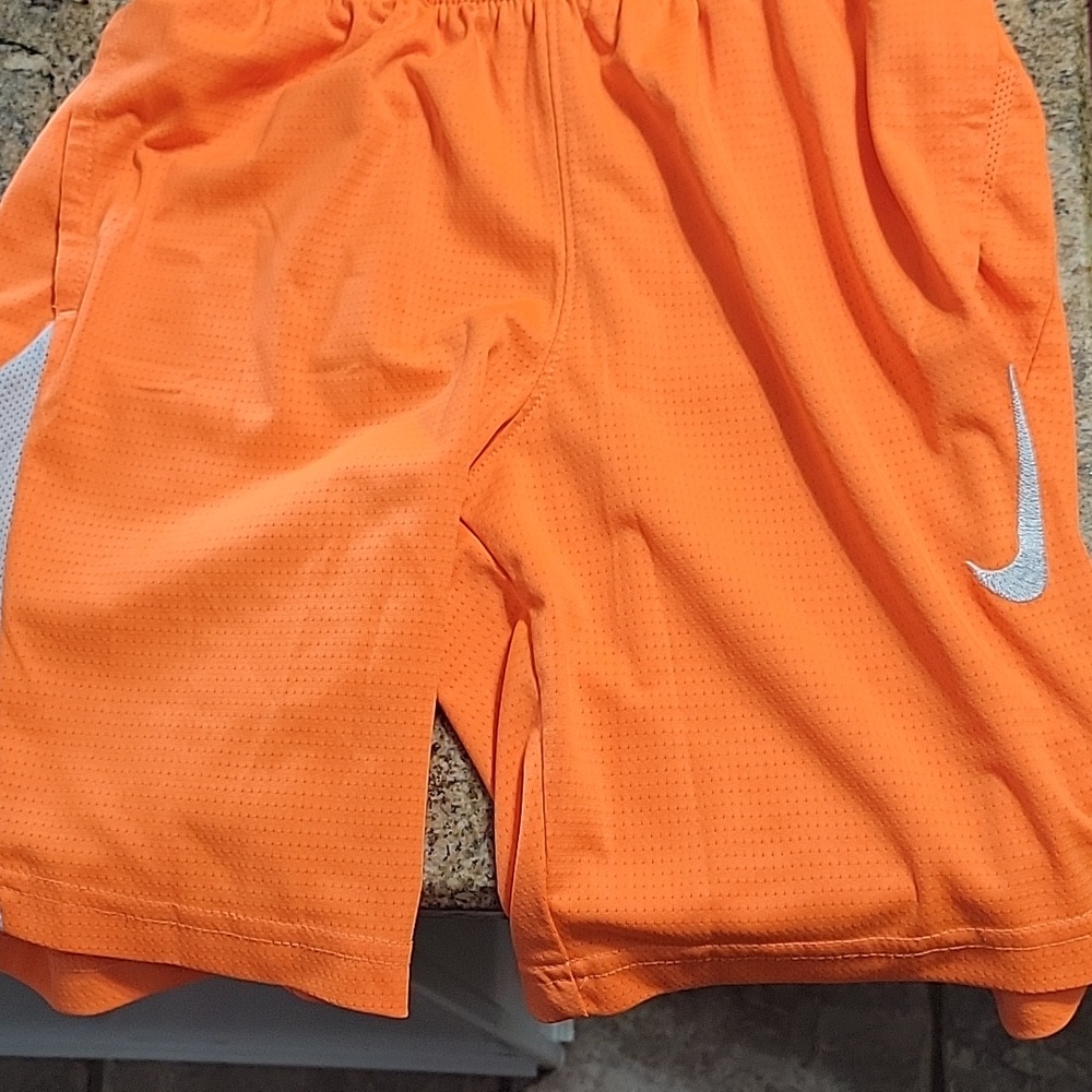 Boys size Small orange nike shorts. Never worn in great condition.